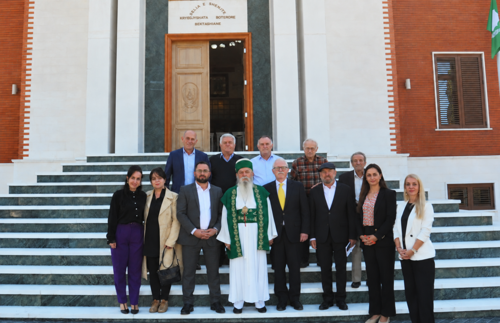 Robert Ince, the Dedebaba and other participants in the interfaith meeting stand together on the steps of the Bektashi World Headquarters.