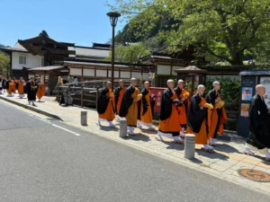 Buddhist monks walk in the Aoi Matsuri procession.